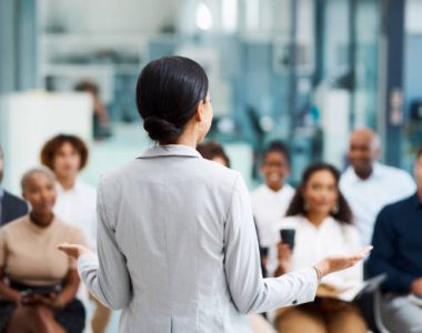 Rearview shot of an unrecognizable businesswoman giving a presentation in the office boardroom